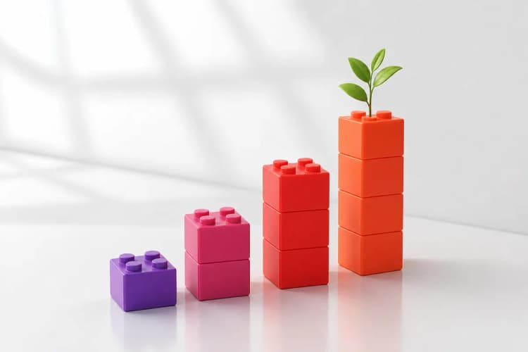 Um gráfico de barras ascendente feito de blocos de construção coloridos, com uma planta crescendo no topo, em um fundo claro.